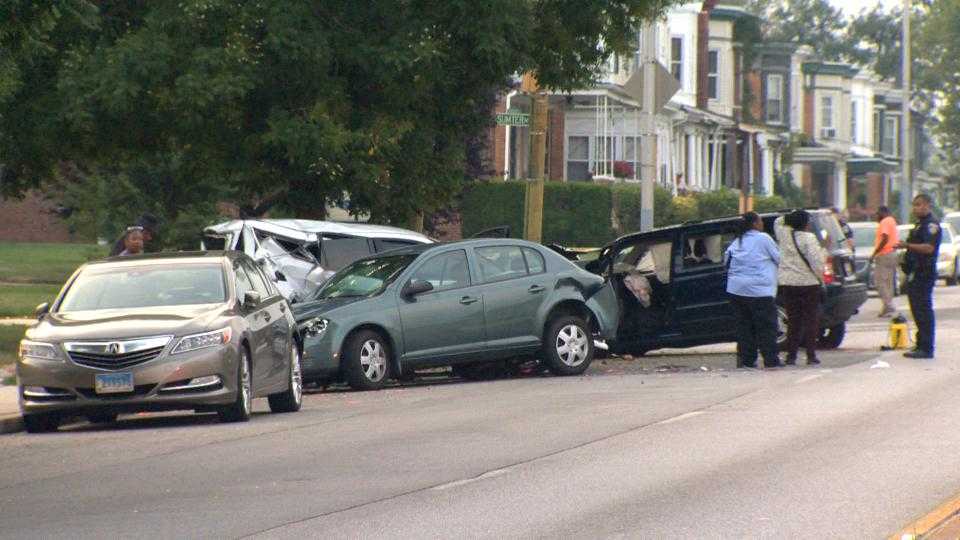 Woman hit parked police vehicle after losing control of her car