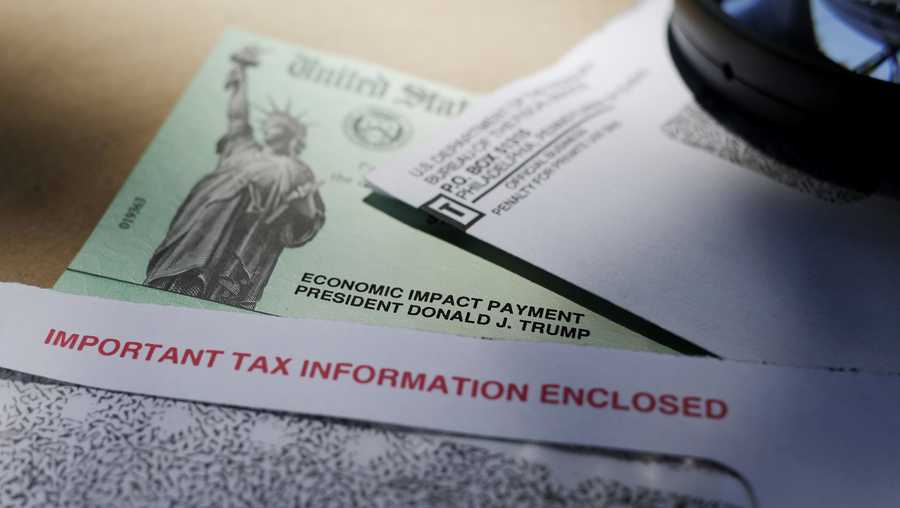 FILE - Hundreds of thousands of dollars in coronavirus relief payments have been sent to people behind bars across the United States, and now the IRS is asking state officials to help claw back the cash that the federal tax agency says was mistakenly sent. (AP Photo/Eric Gay, File)
