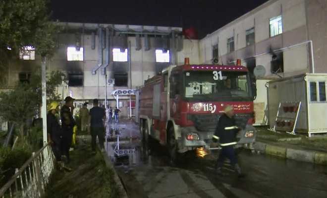 In&#x20;this&#x20;image&#x20;made&#x20;from&#x20;video,&#x20;first&#x20;responders&#x20;work&#x20;the&#x20;scene&#x20;of&#x20;a&#x20;hospital&#x20;fire&#x20;in&#x20;Baghdad&#x20;on&#x20;Saturday,&#x20;April&#x20;24,&#x20;2021.