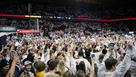 Iowa State fans rush the court following a 79-75 win over Kansas on Saturday, Jan. 27, 2024, in Ames.
