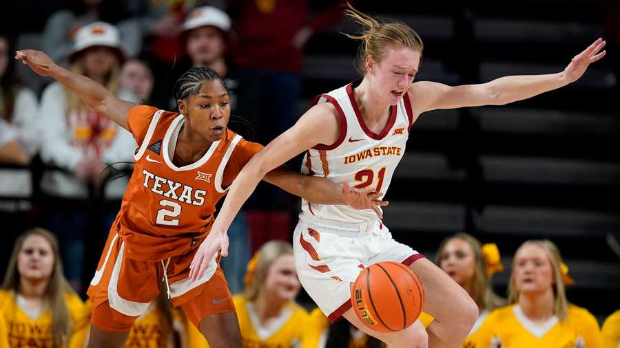 Texas guard Aliyah Matharu (2) fights for a loose ball with Iowa State guard Lexi Donarski (21) during the second half of an NCAA college basketball game, Wednesday, Jan. 19, 2022, in Ames, Iowa.