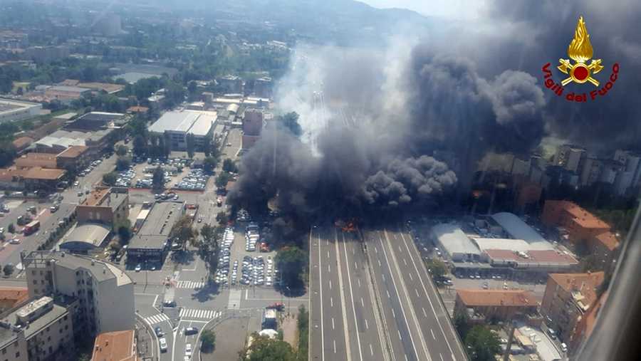 In this photo released by the Italian firefighters, an helicopter view of the explosion on a highway in the outskirts of Bologna, Italy, Monday, Aug. 6, 2018. The explosion was reportedly caused by an accident involving a truck that was transporting flammable substances and exploded upon impact.