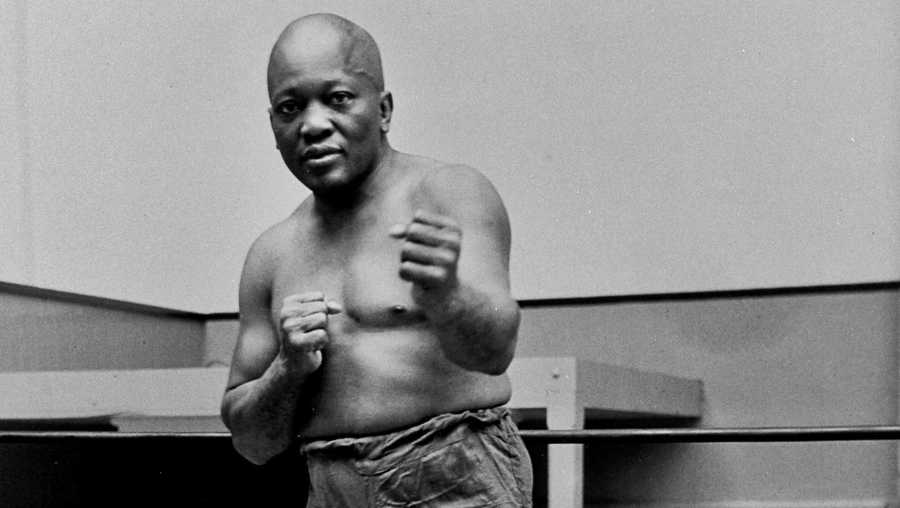 In this 1932 file photo, boxer Jack Johnson, the first black world heavyweight champion, poses in New York City.