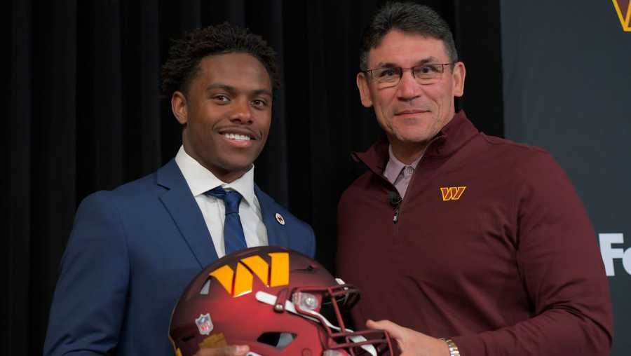 ASHBURN, VA- APRIL 29: Commanders first round draft pick Jahan Dotson, left, poses with head coach Ron Rivera after he is introduced at a press conference at Commanders Park in Ashburn, VA on April 29, 2022.. (Photo by John McDonnell/The Washington Post via Getty Images)