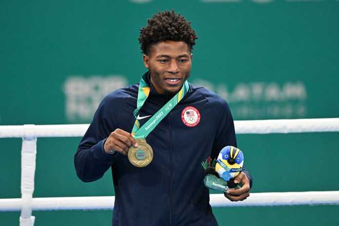 US&amp;apos&#x3B;&#x20;Jahmal&#x20;Harvey&#x20;poses&#x20;with&#x20;the&#x20;gold&#x20;medal&#x20;during&#x20;the&#x20;podium&#x20;ceremony&#x20;of&#x20;the&#x20;men&amp;apos&#x3B;s&#x20;57kg&#x20;gold&#x20;medal&#x20;final&#x20;boxing&#x20;event&#x20;during&#x20;the&#x20;Pan&#x20;American&#x20;Games&#x20;Santiago&#x20;2023&#x20;at&#x20;the&#x20;Olympic&#x20;Training&#x20;Centre&#x20;&#x28;CEO&#x29;&#x20;in&#x20;Santiago&#x20;on&#x20;October&#x20;27,&#x20;2023.&#x20;&#x28;Photo&#x20;by&#x20;Raul&#x20;ARBOLEDA&#x20;&#x2F;&#x20;AFP&#x29;&#x20;&#x28;Photo&#x20;by&#x20;RAUL&#x20;ARBOLEDA&#x2F;AFP&#x20;via&#x20;Getty&#x20;Images&#x29;