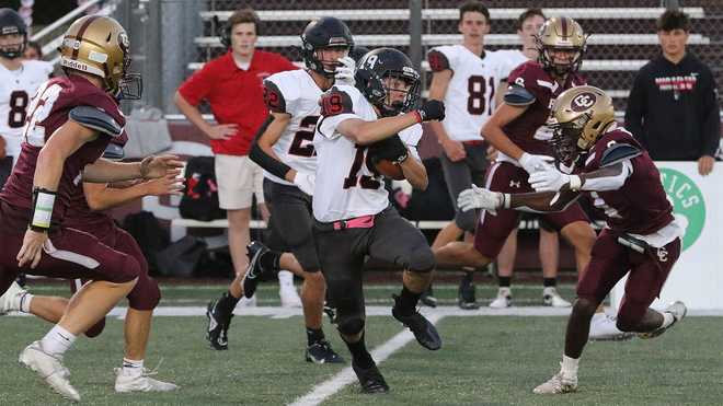 Marblehead senior James Galante makes a cut to gain more yardage against Concord- Carlisle in the first game of his senior season on Sept. 10, 2021.
