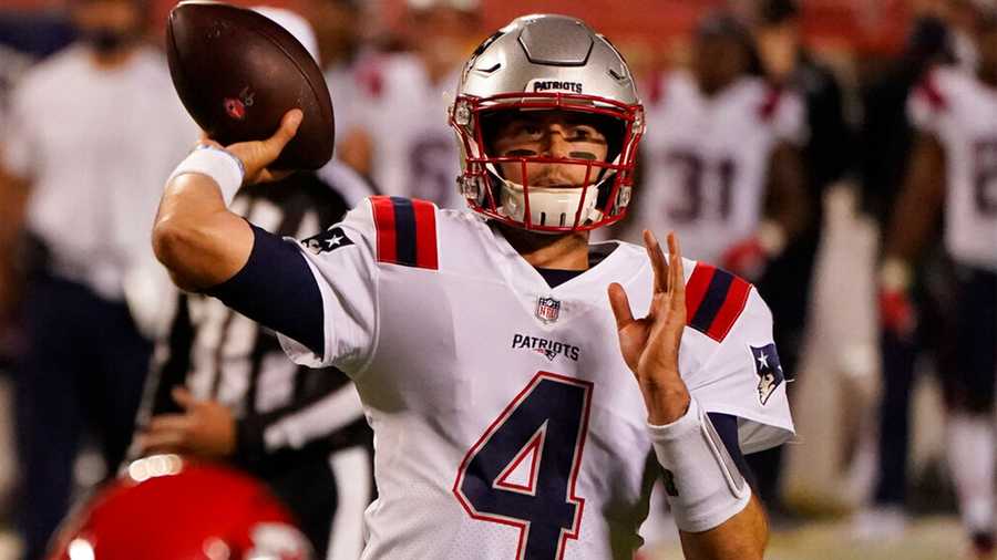 New England Patriots quarterback Jarrett Stidham (4) throws against the Kansas City Chiefs during the second half of an NFL football game, Monday, Oct. 5, 2020, in Kansas City. (AP Photo/Charlie Riedel)