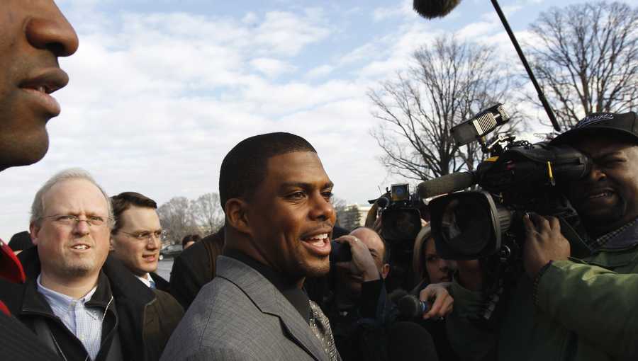 In this Jan. 19, 2011, file photo, Arizona Cardinals running back Jason Wright, center, talks to the media on Capitol Hill in Washington. The Washington Football Team has hired Jason Wright as team president. He’s the first Black person to hold this job in NFL history and at 38 becomes the youngest team president in the league.