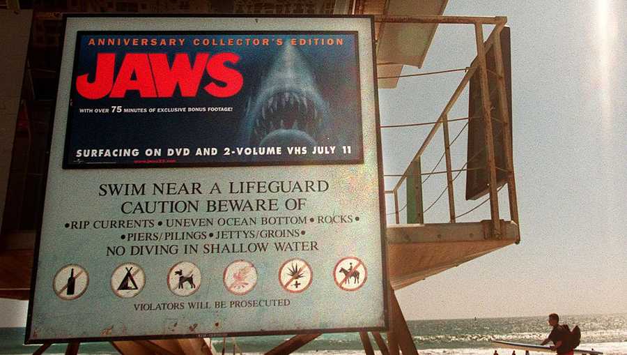 A beach ad on a lifeguard tower at Santa Monica Beach for the re-release of movie "JAWS."