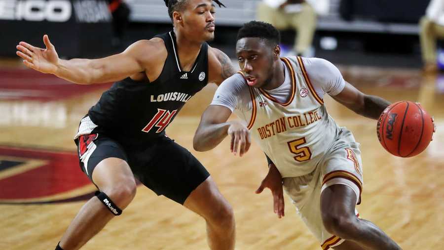 Boston College's Jay Heath (5) drives past Louisville's Dre Davis (14) during the second half of an NCAA college basketball game, Saturday, Jan. 2, 2021, in Boston. (AP Photo)