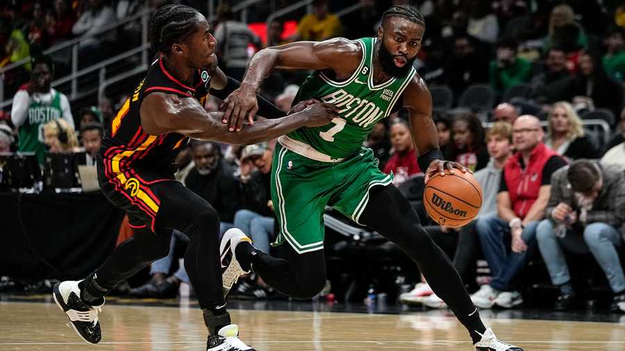 Boston Celtics guard Jaylen Brown (7) drives against Atlanta Hawks forward AJ Griffin (14) during the second half of an NBA basketball game Wednesday, Nov. 16, 2022 in Atlanta.