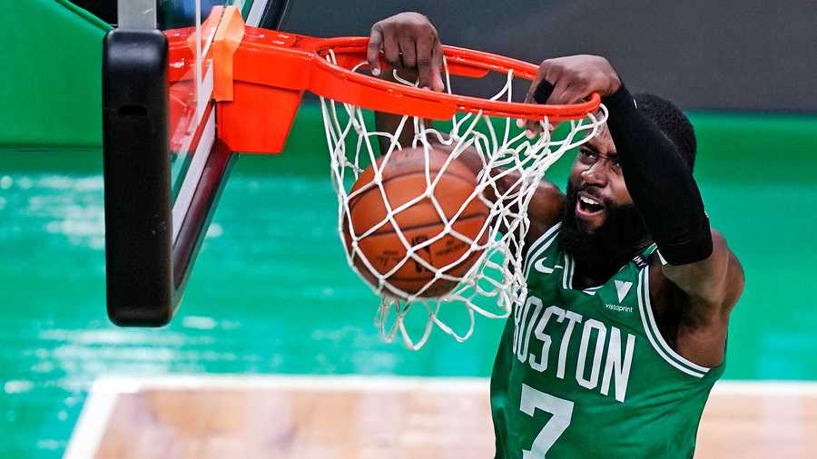 Boston Celtics guard Jaylen Brown (7) dunks against the New York Knicks during the first half of an NBA basketball game, Wednesday, April 7, 2021, in Boston. (AP Photo