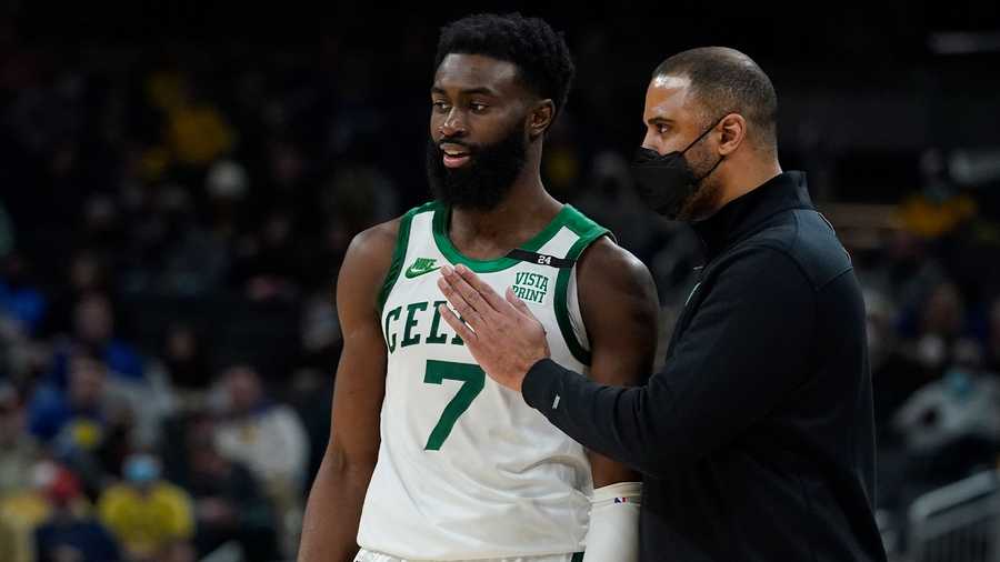 Boston Celtics head coach Ime Udoka talks with Jaylen Brown during the second half of an NBA basketball game against the Indiana Pacers, Wednesday, Jan. 12, 2022, in Indianapolis. (AP Photo)