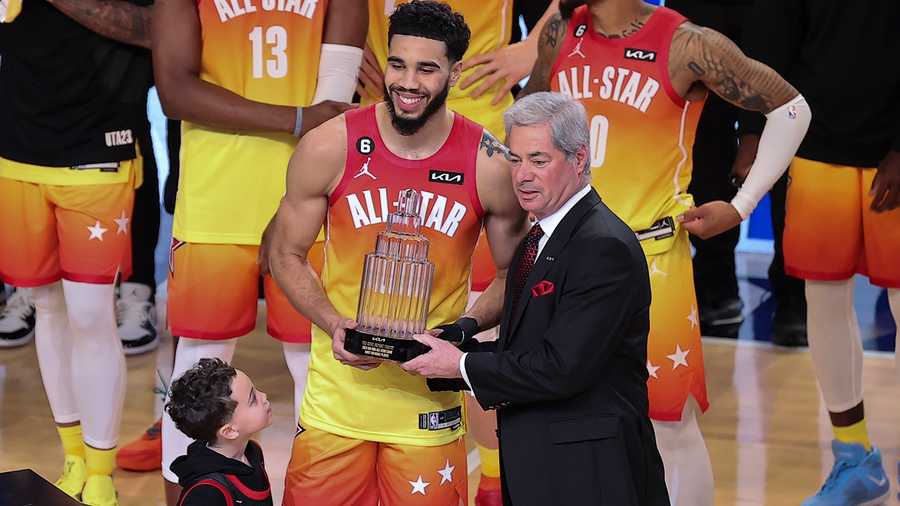 Team Giannis forward Jayson Tatum (0) receives his MVP trophy after the NBA basketball All-Star game Sunday, Feb. 19, 2023, in Salt Lake City.