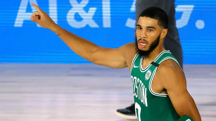 Jayson Tatum of the Boston Celtics celebrates a three-point shot against the Philadelphia 76ers during the first half of Game 2 of an NBA basketball first-round playoff series, Wednesday, Aug. 19, 2020, in Lake Buena Vista, Fla. (Kevin C. Cox/Pool Photo via AP)