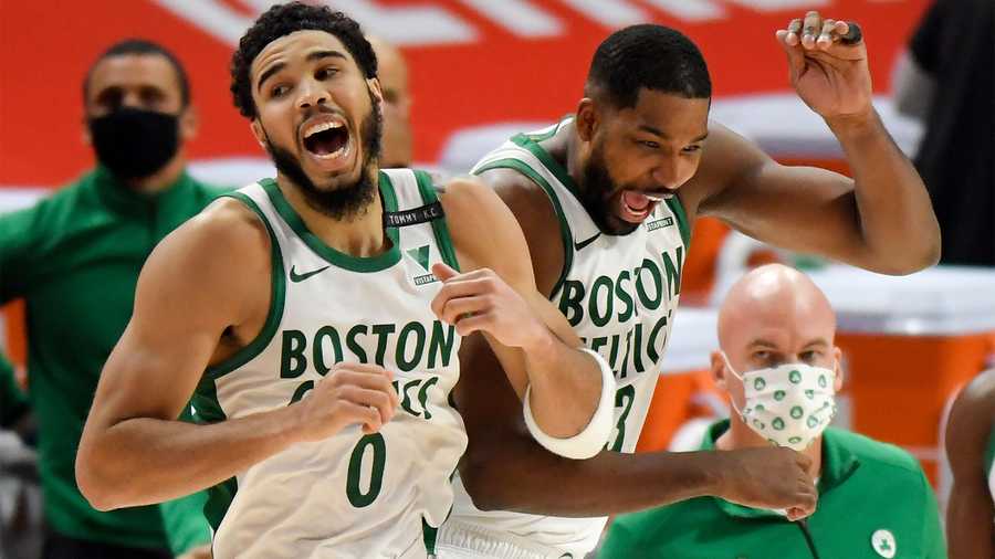 Boston Celtics' Jayson Tatum, left, and Tristan Thompson celebrate after a 122-120 win over the Detroit Pistons in an NBA basketball game, Sunday, Jan. 3, 2021, in Detroit. (AP Photo)