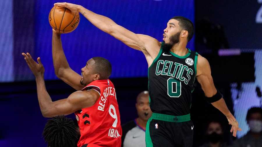 Boston Celtics' Jayson Tatum (0) blocks the shot of Toronto Raptors' Serge Ibaka (9) during the second half of an NBA conference semifinal playoff basketball game Monday, Sept. 7, 2020, in Lake Buena Vista, Fla. (AP Photo/Mark J. Terrill)