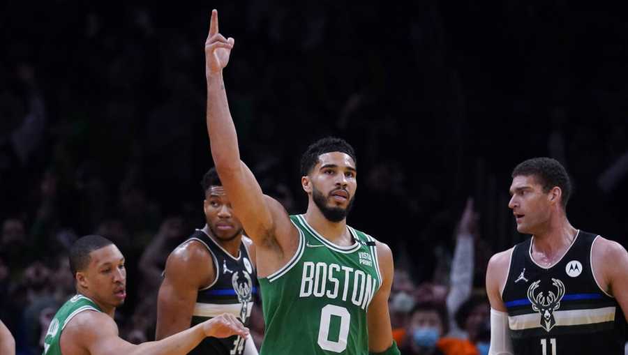 Boston Celtics forward Jayson Tatum (0) celebrates after a basket against the Milwaukee Bucks in the first half of Game 2 of an Eastern Conference semifinal in the NBA basketball playoffs Tuesday, May 3, 2022, in Boston. (AP Photo/Charles Krupa)