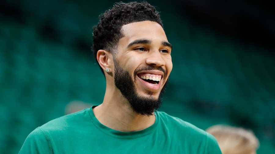 Boston Celtics' Jayson Tatum warms up before Game 3 of the NBA basketball Eastern Conference finals playoff series against the Miami Heat, Saturday, May 21, 2022, in Boston.