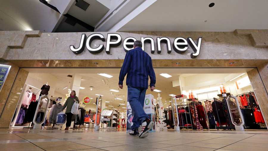 In this Nov. 24, 2017, file photo, a shopper heads into a J.C. Penney store in Seattle.
