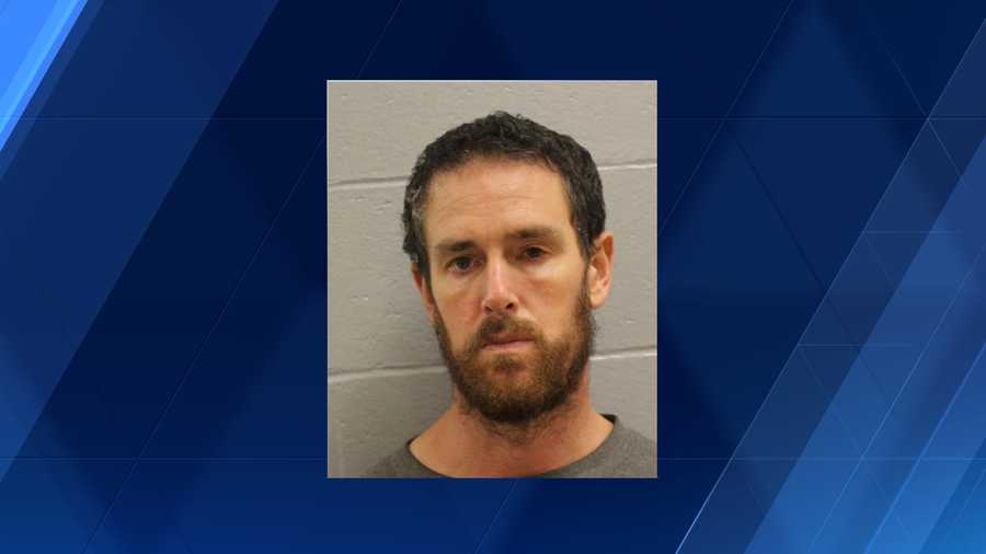 Man accused of hitting woman in parking lot, fleeing scene