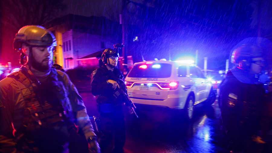 Law enforcement personnel guard near the scene following a shooting, Tuesday, Dec. 10, 2019, in Jersey City, N.J.