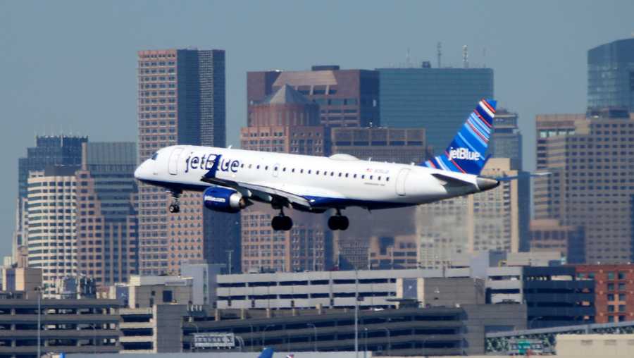 a jetblue plane lands at logan airport in boston