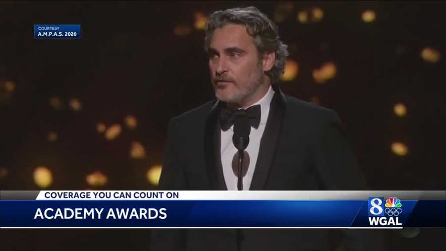 Joaquin Phoenix accepts his first Oscar for his role in "Joker."