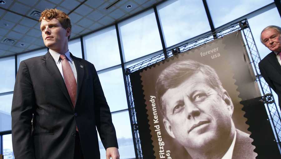 Rep. Joseph P. Kennedy III, D-Mass., left, stands beside the John F. Kennedy Centennial Stamp following dedication ceremonies for the stamp at the John F. Kennedy Library in Boston, Monday, Feb. 20, 2017. 