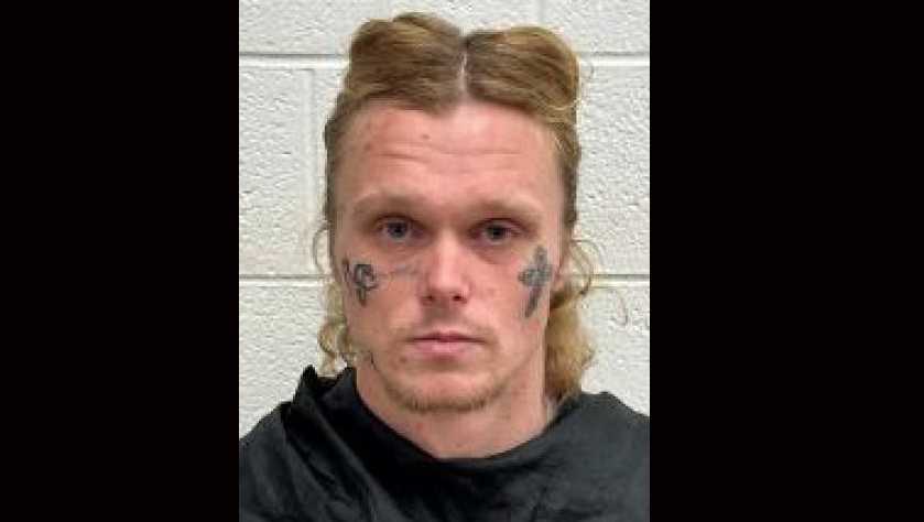 Suspect found covered in blood with 12-gauge shotgun concealed in guitar case, police say