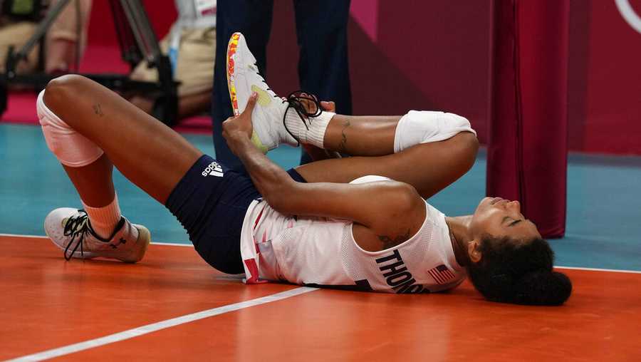 United States&apos; Jordan Thompson lies on the court after an injury during the women&apos;s volleyball preliminary round pool B match between United States and Russian Olympic Committee at the 2020 Summer Olympics, Saturday, July 31, 2021, in Tokyo, Japan. (AP Photo/Frank Augstein)