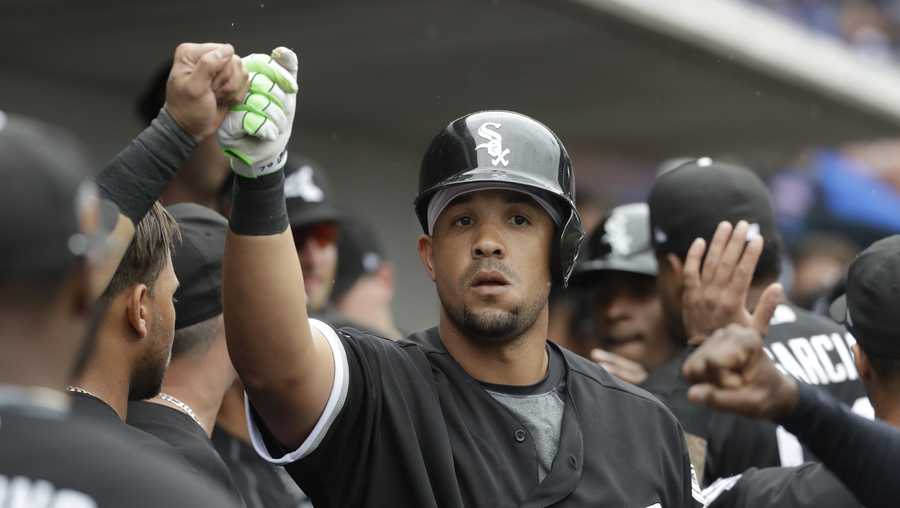 Chicago White Sox's Jose Abreu is congratulated after hitting a two-run home run during the fifth inning a spring training baseball game against the Chicago Cubs Monday, Feb. 27, 2017, in Mesa, Ariz.