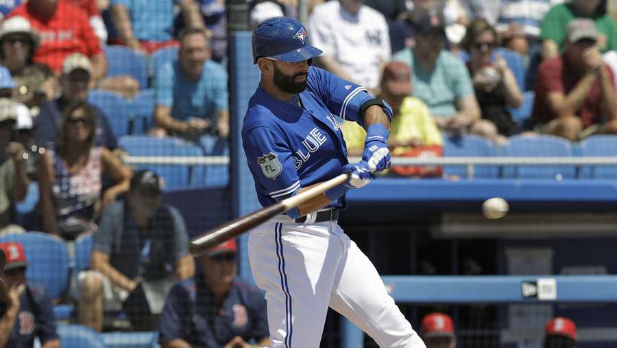 Toronto Blue Jays' Jose Bautista connects for an RBI double off Boston Red Sox starting pitcher Drew Pomeranz during the first inning of a spring training baseball game Friday, March 24, 2017, in Dunedin, Fla.
