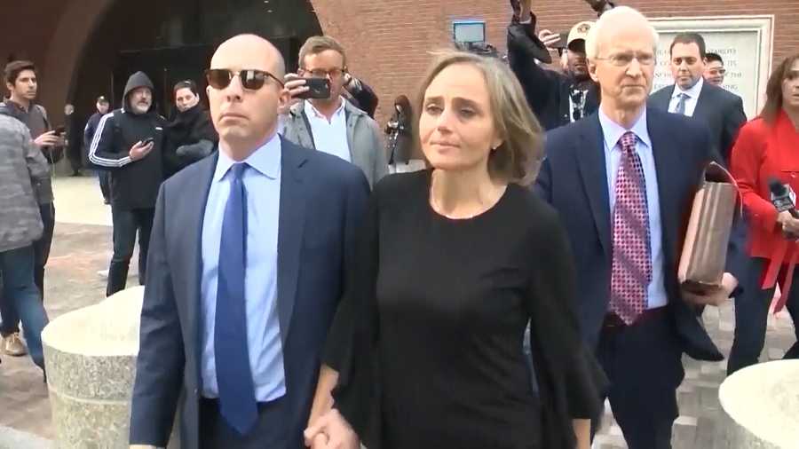 Newton District Court Judge Shelley Joseph, center, walks out of a federal courthouse in Boston on April 25, 2019.