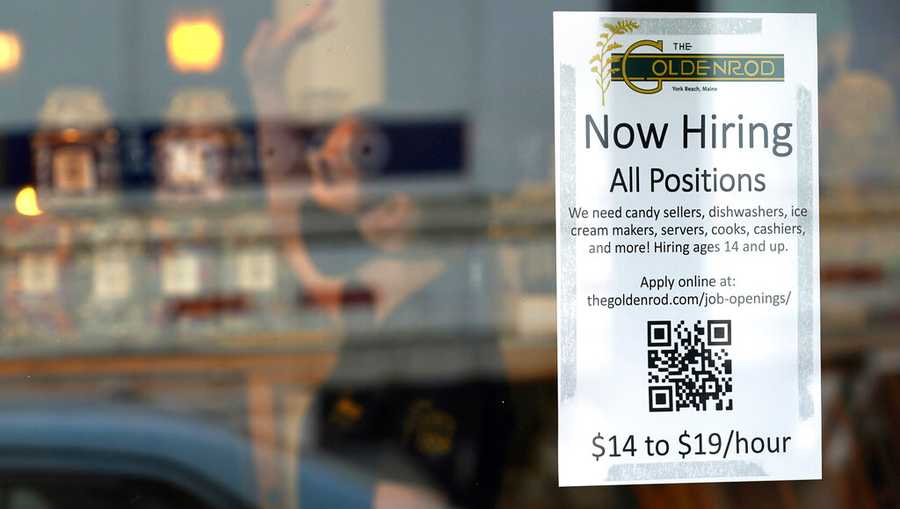 FILE - A sign advertises for help The Goldenrod, a popular restaurant and candy shop, Wednesday, June 1, 2022, in York Beach, Maine. America’s hiring boom continued in July as employers added a surprising 528,000 jobs despite raging inflation and rising anxiety about a recession.  (AP Photo/Robert F. Bukaty)