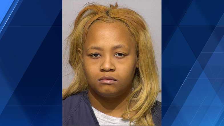 Woman charged in brother's stabbing death