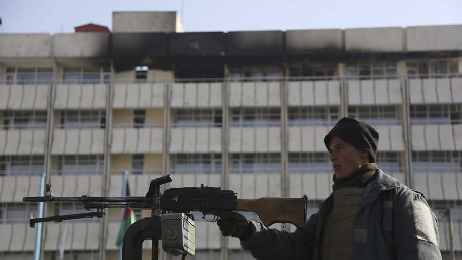 An Afghan police officer stands guard in front of the Intercontinental Hotel in Kabul, Afghanistan, Tuesday, Jan. 23, 2018.