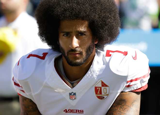 Michael Vick to Colin Kaepernick: Cut your afro