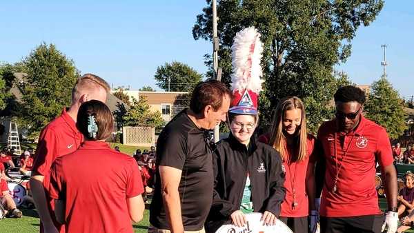 katelyn dill presented with mdb hat and drum head