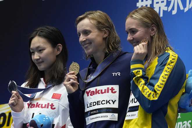 Medalists,&#x20;from&#x20;left&#x20;to&#x20;right,&#x20;Li&#x20;Bingjie&#x20;of&#x20;China,&#x20;silver,&#x20;Katie&#x20;Ledecky&#x20;of&#x20;the&#x20;U.S.,&#x20;gold,&#x20;and&#x20;Ariarne&#x20;Titmus&#x20;of&#x20;Australia,&#x20;bronze,&#x20;celebrate&#x20;during&#x20;the&#x20;medal&#x20;ceremony&#x20;for&#x20;the&#x20;women&#x27;s&#x20;800m&#x20;freestyle&#x20;at&#x20;the&#x20;World&#x20;Swimming&#x20;Championships&#x20;in&#x20;Fukuoka,&#x20;Japan,&#x20;Saturday,&#x20;July&#x20;29,&#x20;2023.