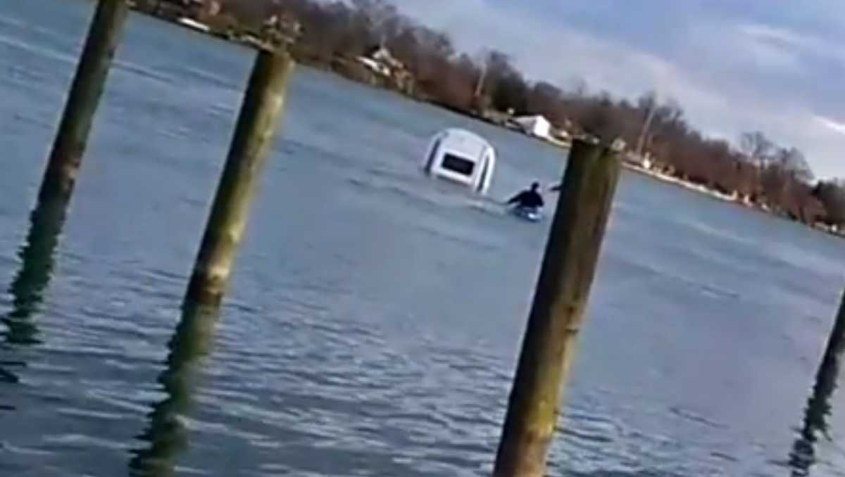 Watch Officer Uses Found Kayak To Rescue Woman From Car Sinking In River