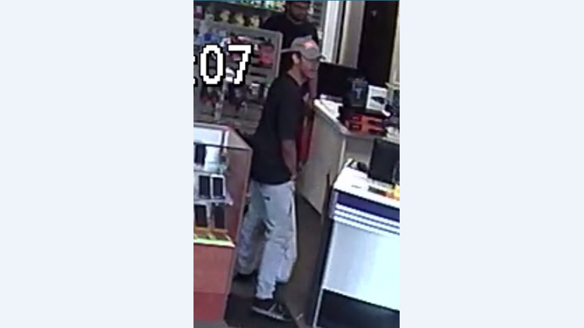 Photos: KCPD asking for help to identify suspect in phone store robbery
