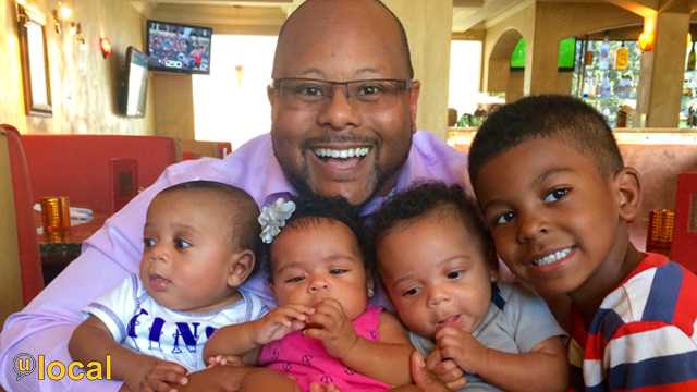 "My wonderful husband with our 4-year-old and 5-month triplets."
