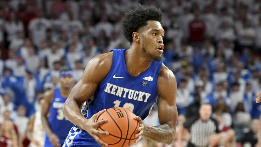 Kentucky forward Keion Brooks Jr. (12) runs a play against Arkansas during the second half of an NCAA college basketball game Saturday, Feb. 26, 2022, in Fayetteville, Ark. (AP Photo/Michael Woods)