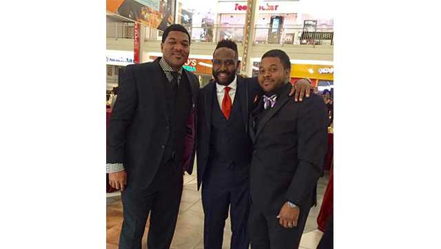 Baltimore police spokesman T.J. Smith, former NFL star Keion Carpenter and Kedrick Orange pose at the Black Tie Affair at Mondawmin Mall last summer. Carpenter died this week at the age of 39.