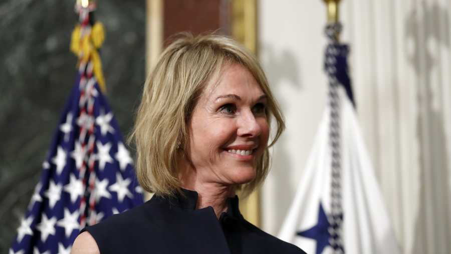 U.S. Ambassador to Canada Kelly Knight Craft stands during her swearing in ceremony in the Indian Treaty Room in the Eisenhower Executive Office Building on the White House grounds, Tuesday, Sept. 26, 2017, in Washington.