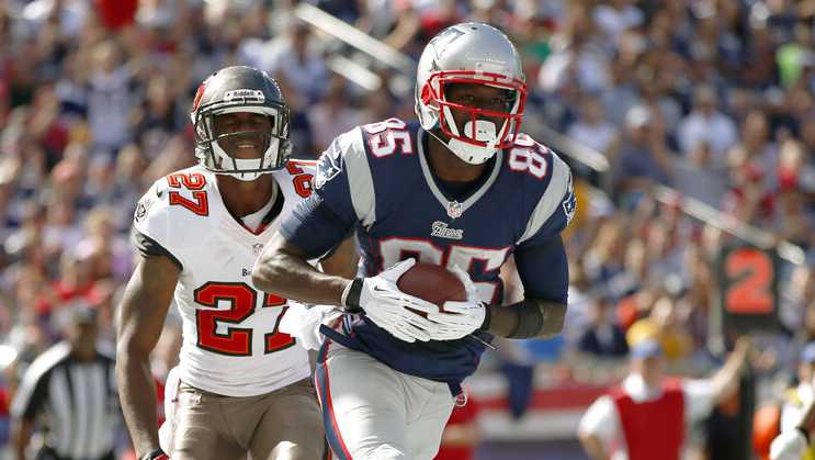 New England Patriots wide receiver Kenbrell Thompkins (85) makes his second touchdown catch in front of Tampa Bay Buccaneers cornerback Johnthan Banks (27) in the first half of an NFL football game Sunday, Sept. 22, 2013, in Foxborough, Mass. (AP Photo/Elise Amendola)