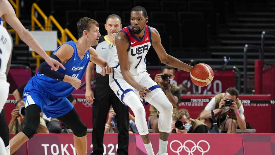 United States&apos;s Kevin Durant (7) works the ball against Czech Republic&apos;s Jan Vesely (24) during a men&apos;s basketball preliminary round game at the 2020 Summer Olympics, Saturday, July 31, 2021, in Saitama, Japan. (AP Photo/Eric Gay)