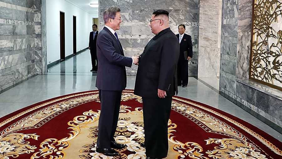 In this handout image provided by South Korean Presidential Blue House, South Korean President Moon Jae-in (L) shake hands with North Korean leader Kim Jong Un (R) before their meeting on May 26, 2018 in Panmunjom, North Korea.