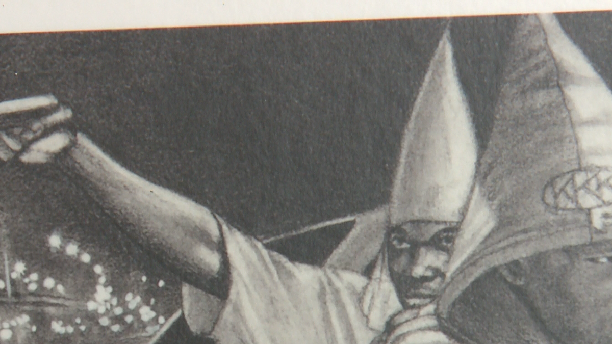 Art exhibit features gang members dressed in Ku Klux Klan garb